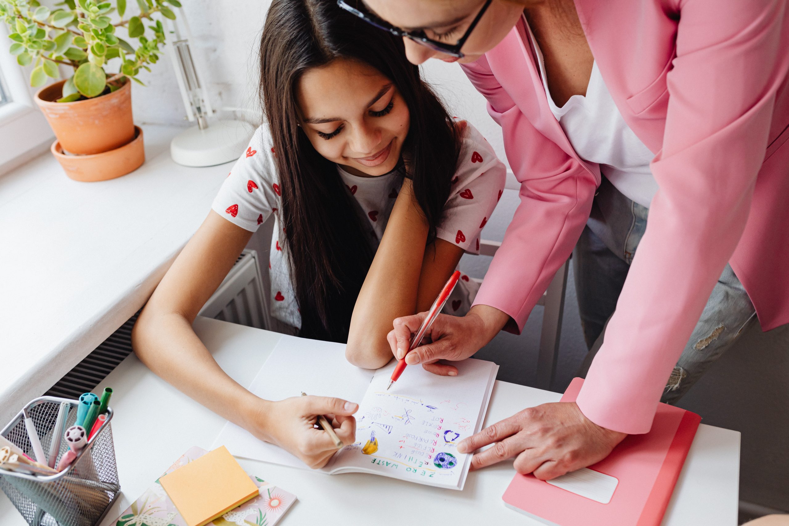 A young girl and a speech therapist work together. Short-term Speech therapy coverage.